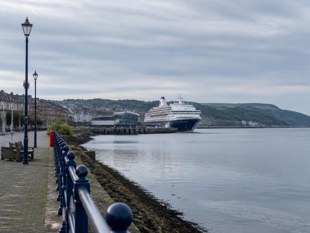 Cruise ship docked at Greenock Ocean Terminal viewed from the waterfront promenade